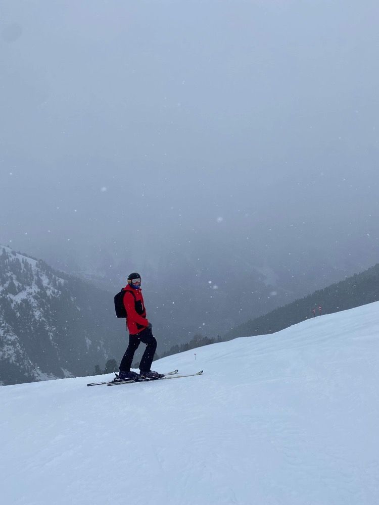 Picture of me standing on a ski slope with snow falling around me.